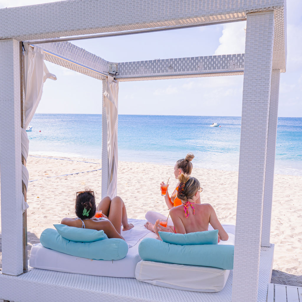 Female Guests on lounger on beach